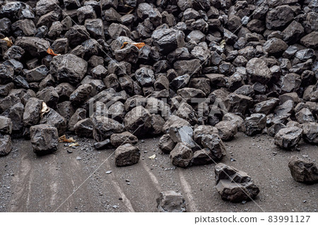 Pile of brown coal for heating Pile of brown coal for heating 83991127