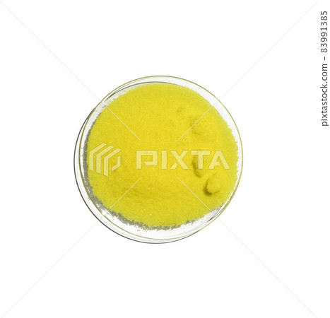 Close up chemical ingredient on white laboratory table. Potassium Chromate powder in Chemical Watch Glass. Top View Close up chemical ingredient on white laboratory table. Potassium Chromate powder in Chemical Watch Glass. Top View 83991385