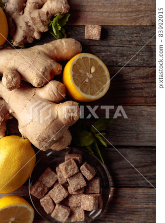 Ingredients for ginger tea on a old wooden table. 83992015