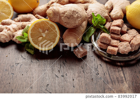 Ingredients for ginger tea on a old wooden table. Ingredients for ginger tea on a old wooden table. 83992017