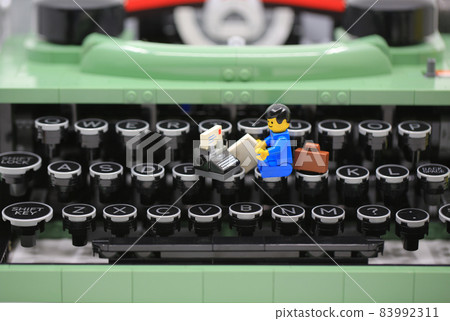 office boy working on the old fashioned typewriter office boy working on the old fashioned typewriter 83992311