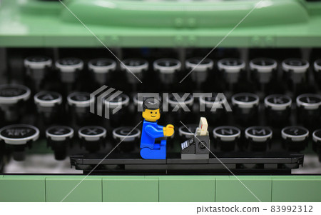 office boy working on the old fashioned typewriter office boy working on the old fashioned typewriter 83992312