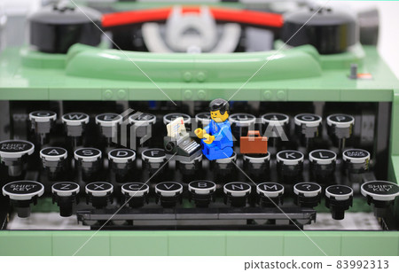 office boy working on the old fashioned typewriter office boy working on the old fashioned typewriter 83992313