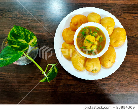 Jharkhand's famous snack Dhuska with potato curry 83994309