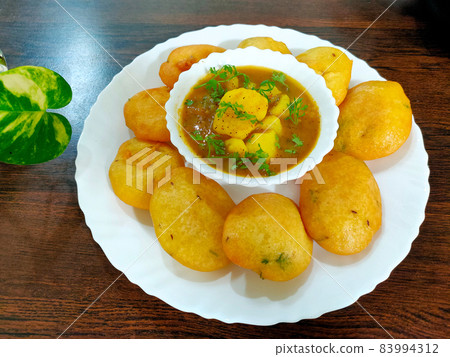 Jharkhand's famous snack Dhuska with potato curry 83994312