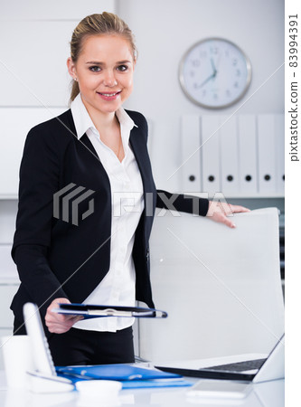 Business woman standing in office 83994391