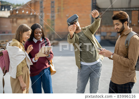 Mixed races students at university campus outdoors Mixed races students at university campus outdoors 83996116