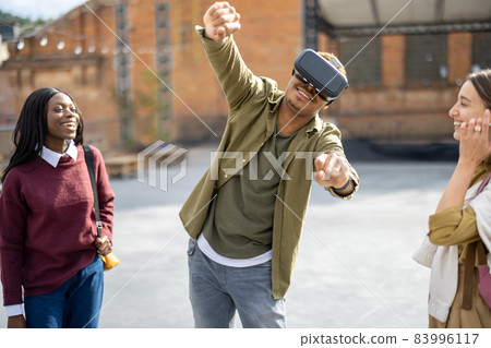 Mixed races students at university campus outdoors Mixed races students at university campus outdoors 83996117