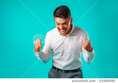 Angry furious hispanic man in rage portrait 83996980