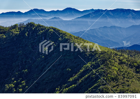 Kagura no Mine and Echigo Sanzan seen from the climb of Mt. Naeba in summer Kagura no Mine and Echigo Sanzan seen from the climb of Mt. Naeba in summer 83997091