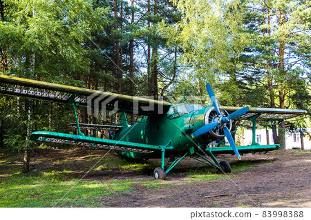 Old abandoned aircraft in the forest 83998388