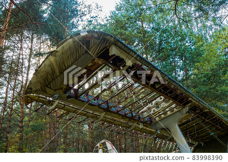 Old abandoned aircraft in the forest Old abandoned aircraft in the forest 83998390