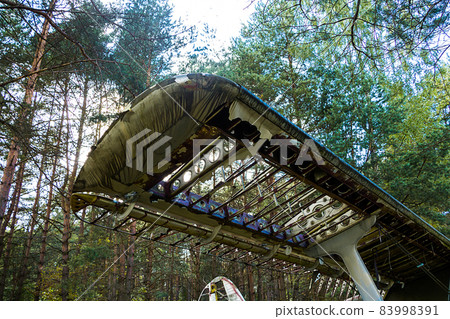 Old abandoned aircraft in the forest Old abandoned aircraft in the forest 83998391