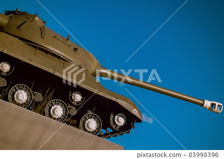 Military monument - an old tank on a pedestal. Symbol of Victory Day - military tank on a pedestal Military monument - an old tank on a pedestal. Symbol of Victory Day - military tank on a pedestal 83998396