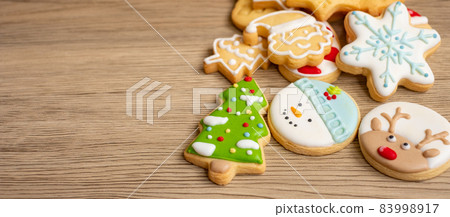 Merry Christmas with homemade cookies on wood table background. Xmas, party, holiday and happy New Year concept Merry Christmas with homemade cookies on wood table background. Xmas, party, holiday and happy New Year concept 83998917