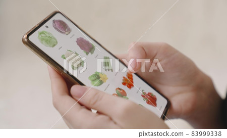 hands order vegetable products online, finger swiping on smartphone, business lady food, vegetarian food retail, customer pay online, home supermarket market, smart wireless e-commerce, store service hands order vegetable products online, finger swiping on smartphone, business lady food, vegetarian food retail, customer pay online, home supermarket market, smart wireless e-commerce, store service 83999338