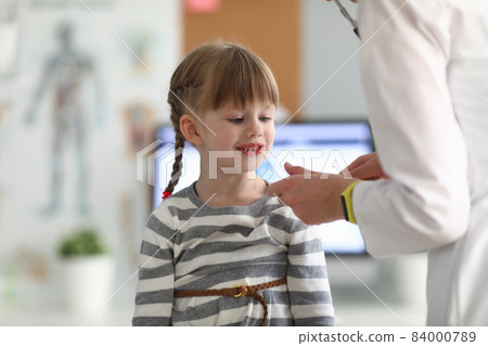 Little beautiful girl at doctor appointment closeup 84000789
