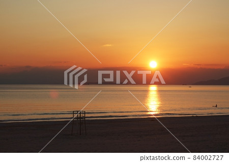 Autumn sandy beach and calm evening sky Autumn sandy beach and calm evening sky 84002727