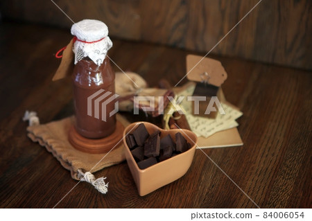 chocolate Smoothie at the bottle. Colorful drink in bottle with organic chocolate and superfoods on a wooden background. Healthy, clean eating, vegan, vegetarian, detox, dieting breakfast food snack chocolate Smoothie at the bottle. Colorful drink in bottle with organic chocolate and superfoods on a wooden background. Healthy, clean eating, vegan, vegetarian, detox, dieting breakfast food snack 84006054