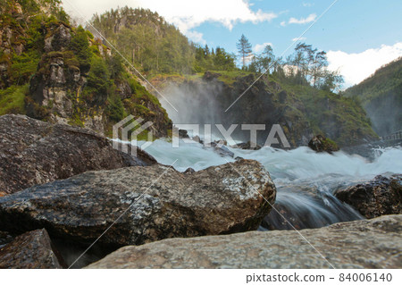 Granite rock and Latefossen or Latefoss - one of the biggest waterfalls in Norway, Scandinavia, Europe Granite rock and Latefossen or Latefoss - one of the biggest waterfalls in Norway, Scandinavia, Europe 84006140