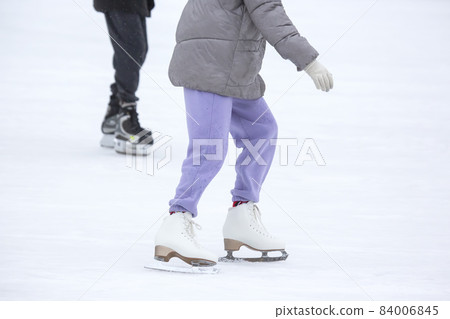 ice skating woman legs on ice rink. hobbies and winter sports ice skating woman legs on ice rink. hobbies and winter sports 84006845