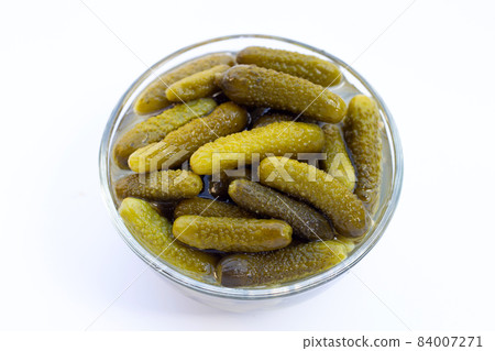 Pickled gherkins or cucumbers on white background. 84007271