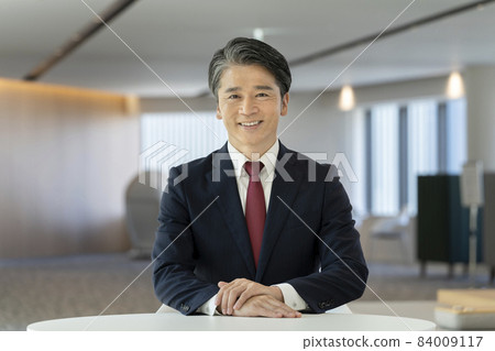 A businessman in his 50s smiling looking at the camera, shooting cooperation "LINK FOREST" 84009117