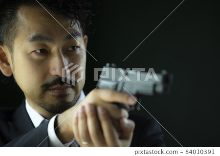 A mustache person playing with a model gun A mustache person playing with a model gun 84010391