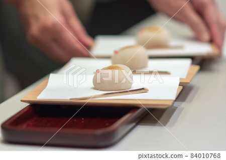 Rabbit Wagashi Mooncakes, traditional Japanese sweets served with tea Rabbit Wagashi Mooncakes, traditional Japanese sweets served with tea 84010768