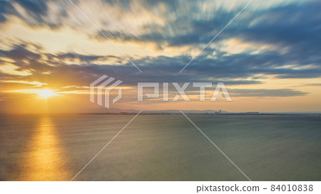 Sunset over the ocean in Osaka Bay with dramatic sky and clouds 84010838