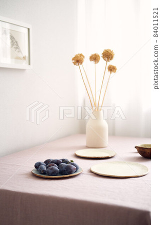 Modern dining table setting. Only natural materials - earthenware, linen textiles, dried flowers. Modern dining table setting. Only natural materials - earthenware, linen textiles, dried flowers. 84011521