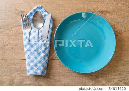 empty plate or dish with knife, fork and spoon empty plate or dish with knife, fork and spoon 84011610