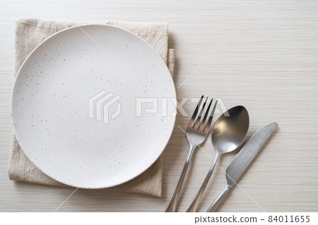 empty plate or dish with knife, fork and spoon 84011655