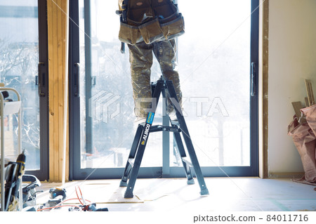 Fashionable carpenter's work scene during remodeling 84011716