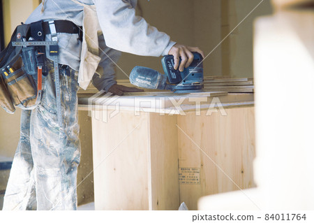 Fashionable carpenter's work scene during remodeling Fashionable carpenter's work scene during remodeling 84011764