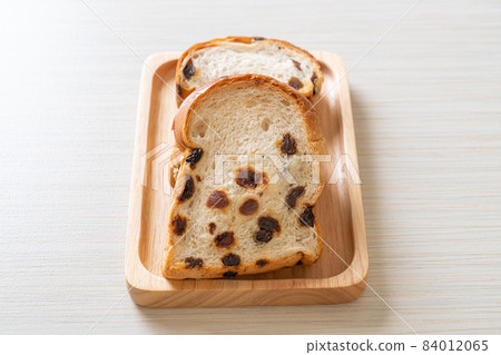 raisin bread with coffee cup 84012065
