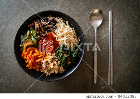 Korean spicy salad with rice - traditionally Korean food, Bibimbap Korean spicy salad with rice - traditionally Korean food, Bibimbap 84012083