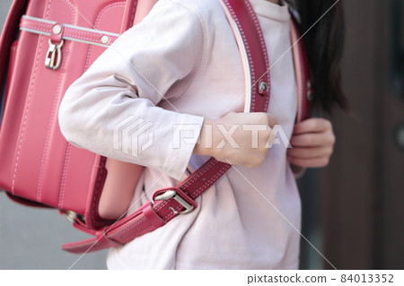 Elementary school girl going to and from school 84013352