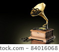 Old antique Gramophone or Phonograph and black music notes in dark black background. It's a popular mythical music player. It works by wind up. The concept of music and aesthetics. 84016068