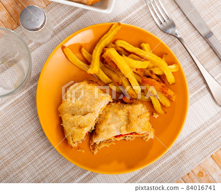 Goat cheese and pepper booklets with fries Goat cheese and pepper booklets with fries 84016741