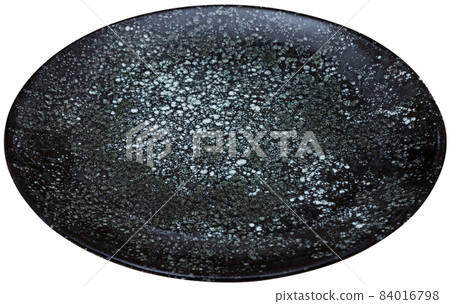 Empty round black plate on white 84016798