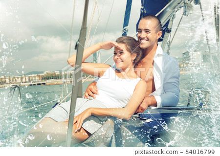 Couple sailing on yacht along Spain 84016799