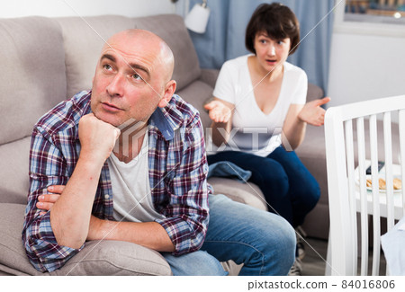 Quarrel between husband and wife in the apartment 84016806
