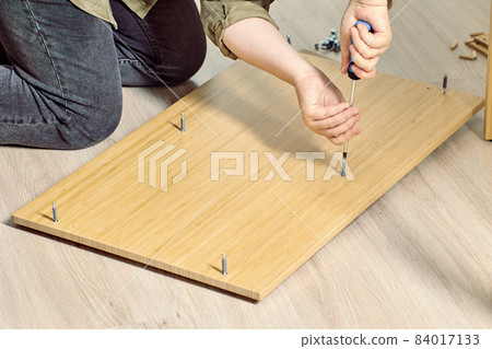 Diy assembly of furniture from flat pack at home. 84017133