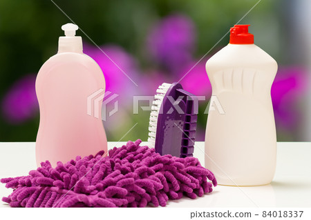 Bottles of washing liquid and brush on white background. 84018337
