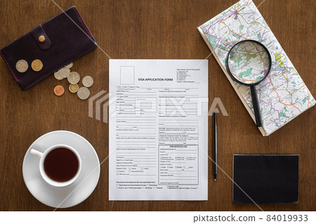 Visa application form on a wooden table, visa processing, registration, flat lay 84019933