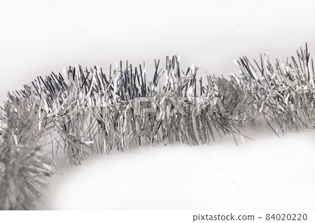 Silver Christmas tinsel with stars. Silver Christmas tinsel with stars. 84020220