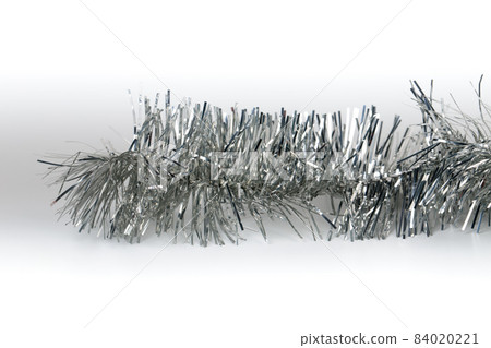 Silver Christmas tinsel with stars. Silver Christmas tinsel with stars. 84020221