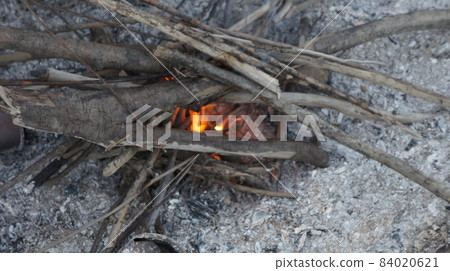 Bonfire in the taiga, the fire is getting hot 84020621