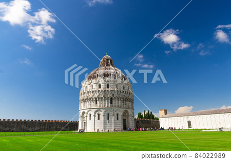 Pisa Baptistery Battistero di Pisa on Piazza del Miracoli Duomo square green grass lawn 84022989
